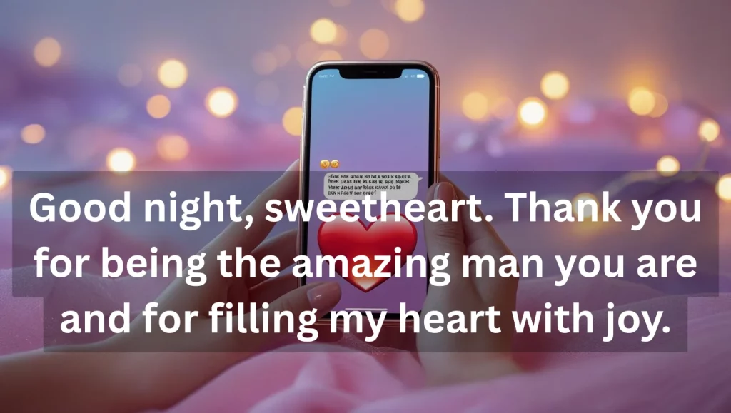 Sweet good night text message on smartphone with heart emojis and fairy lights