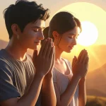 Husband and wife praying together during beautiful sunrise morning